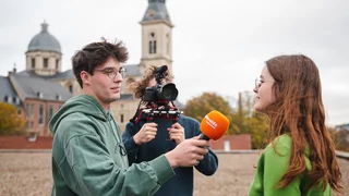two journalist students interviewing another student in Ghent, Belgium